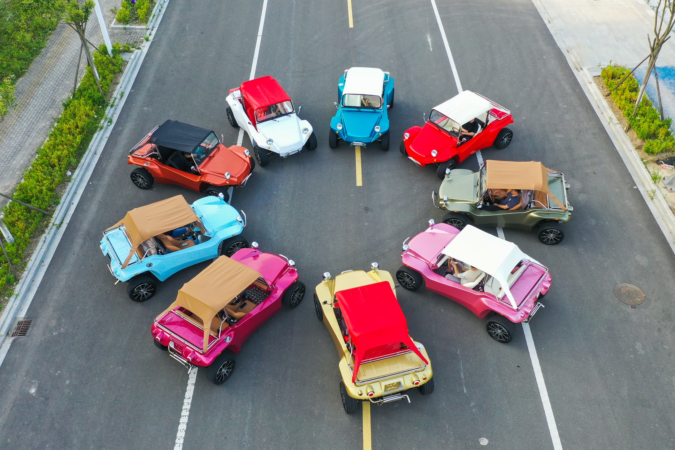 Multiple colored eVbuggies on the road